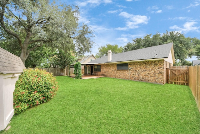 3938 Danpree St, Pasadena, TX 77504 - fenced backyard with a patio and a gate