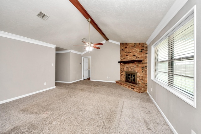 3938 Danpree St, Pasadena, TX 77504 - unfurnished living room with ceiling fan, a textured ceiling, a brick fireplace, carpet, and crown molding