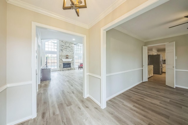 18318 Widcombe Dr, Houston, TX 77084 - hallway featuring light wood-style flooring and crown molding