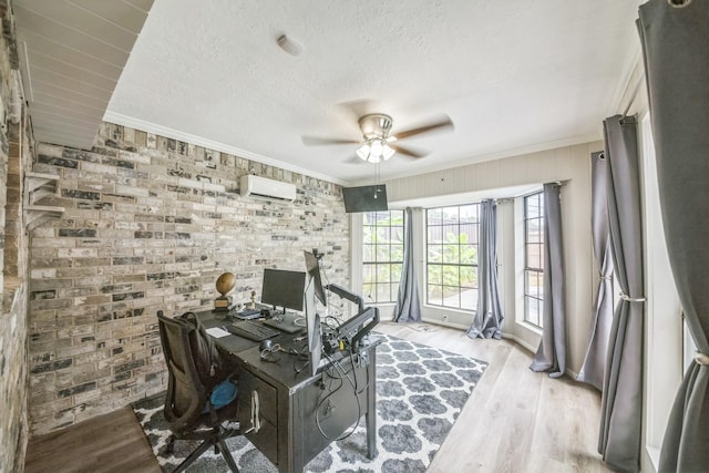 18318 Widcombe Dr, Houston, TX 77084 - office area with ornamental molding, a ceiling fan, wood finished floors, brick wall, and an AC wall unit