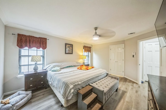 18318 Widcombe Dr, Houston, TX 77084 - bedroom featuring light wood-style floors, crown molding, and a ceiling fan