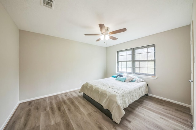 18318 Widcombe Dr, Houston, TX 77084 - bedroom with wood finished floors and a ceiling fan