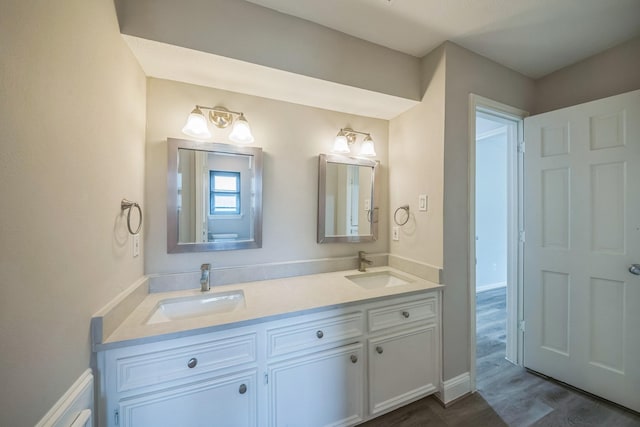 18318 Widcombe Dr, Houston, TX 77084 - full bathroom featuring double vanity and wood finished floors