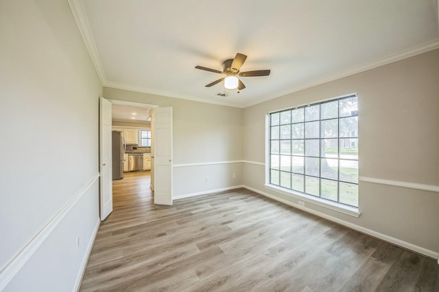 18318 Widcombe Dr, Houston, TX 77084 - unfurnished room with a ceiling fan, light wood finished floors, and ornamental molding