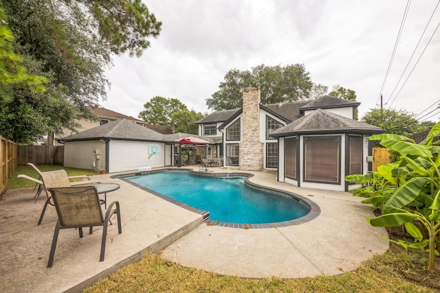 18318 Widcombe Dr, Houston, TX 77084 - view of swimming pool featuring a patio area and a fenced backyard