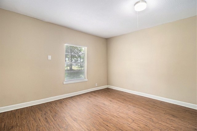 5235 Kingsbury St, Houston, TX 77021 - spare room featuring baseboards and wood finished floors