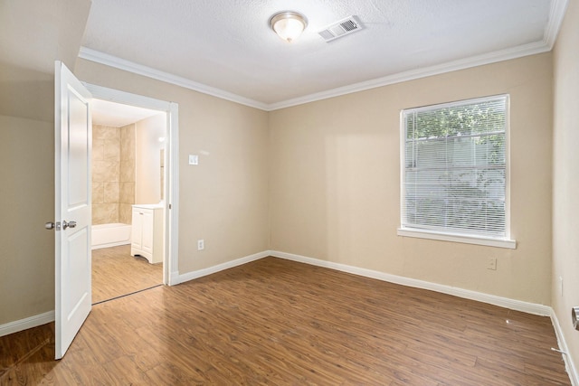 5235 Kingsbury St, Houston, TX 77021 - empty room featuring wood finished floors and crown molding