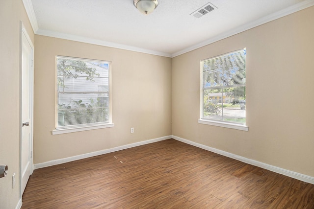 5235 Kingsbury St, Houston, TX 77021 - unfurnished room featuring crown molding, plenty of natural light, and wood finished floors