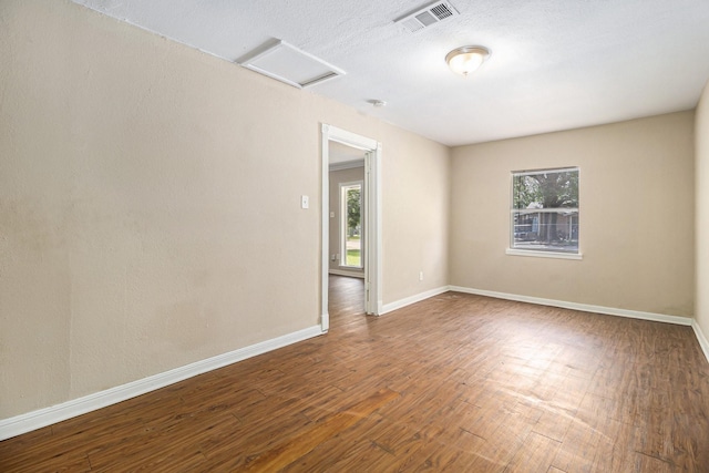 5235 Kingsbury St, Houston, TX 77021 - unfurnished room with attic access, plenty of natural light, and wood finished floors