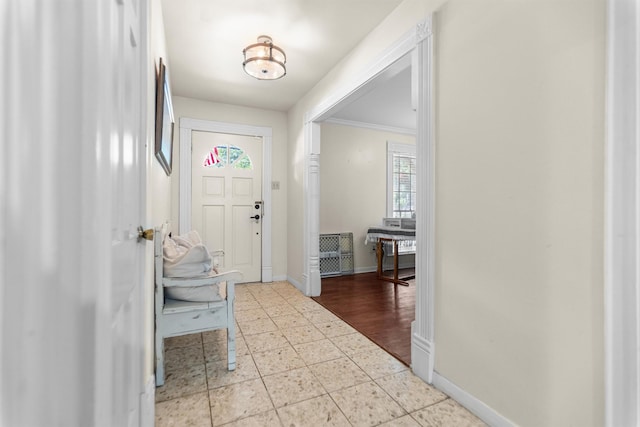 907 E Houston Ave, Crockett, TX 75835 - foyer with baseboards and crown molding