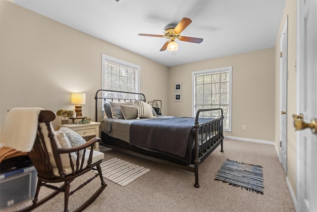 907 E Houston Ave, Crockett, TX 75835 - bedroom with multiple windows, light carpet, and ceiling fan