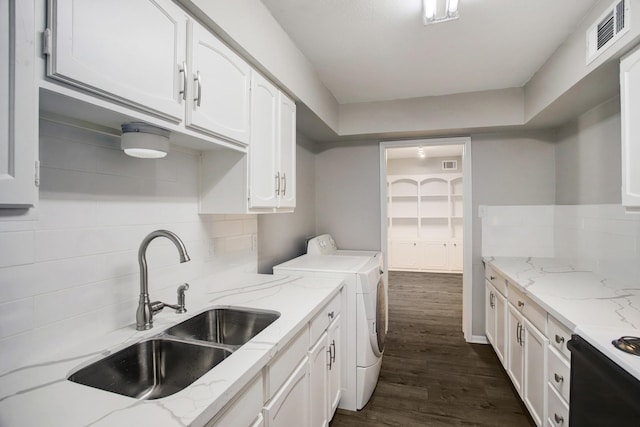 353 N Post Oak Ln Unit 819, Houston, TX 77024 - kitchen featuring white cabinets, dark wood-style flooring, washer and dryer, backsplash, and electric stove