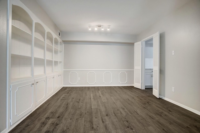 353 N Post Oak Ln Unit 819, Houston, TX 77024 - unfurnished room featuring dark wood-type flooring