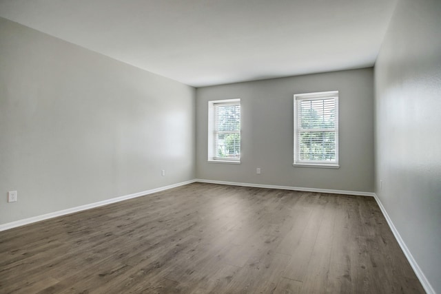 353 N Post Oak Ln Unit 819, Houston, TX 77024 - unfurnished room with dark wood-style flooring and baseboards