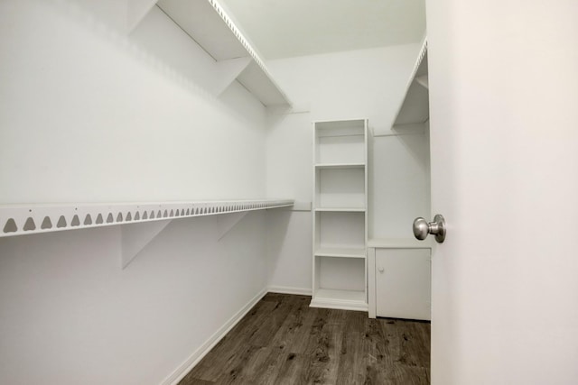 353 N Post Oak Ln Unit 819, Houston, TX 77024 - walk in closet featuring wood finished floors