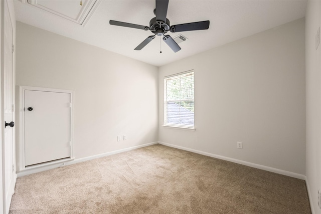 107 N Sunny Slope Cir, The Woodlands, TX 77381 - empty room with attic access, carpet flooring, and a ceiling fan