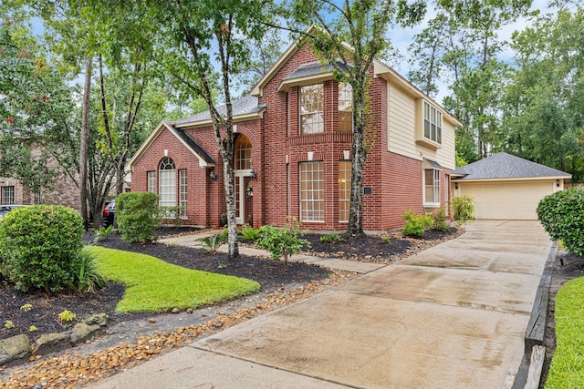 107 N Sunny Slope Cir, The Woodlands, TX 77381 - traditional-style home with brick siding, an outbuilding, and a garage