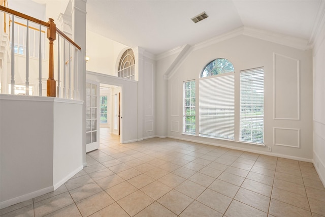 107 N Sunny Slope Cir, The Woodlands, TX 77381 - unfurnished room featuring light tile patterned flooring, lofted ceiling, crown molding, french doors, and stairs