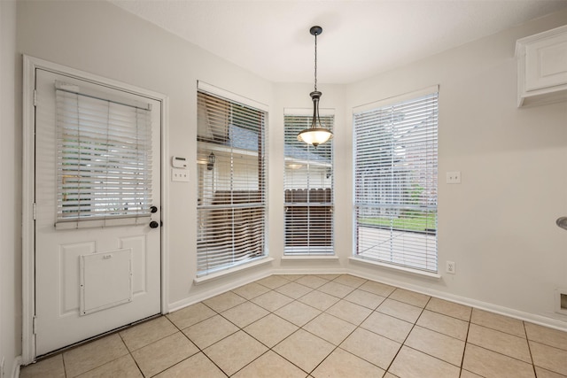 107 N Sunny Slope Cir, The Woodlands, TX 77381 - unfurnished dining area with light tile patterned floors and baseboards