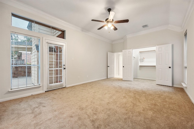 107 N Sunny Slope Cir, The Woodlands, TX 77381 - unfurnished bedroom with carpet, ornamental molding, access to outside, ceiling fan, and lofted ceiling
