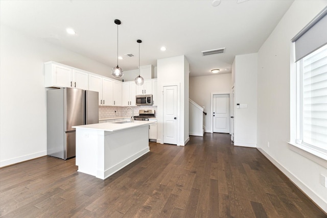 4155 Griggs Rd, Houston, TX 77021 - kitchen featuring stainless steel appliances, tasteful backsplash, dark wood-style floors, light countertops, and recessed lighting