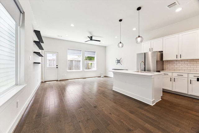 4155 Griggs Rd, Houston, TX 77021 - kitchen featuring freestanding refrigerator, open floor plan, ceiling fan, decorative backsplash, and dark wood-style floors