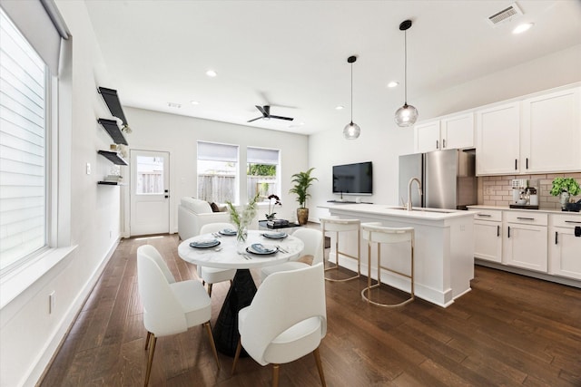 4155 Griggs Rd, Houston, TX 77021 - dining room with dark wood-type flooring, a ceiling fan, and recessed lighting