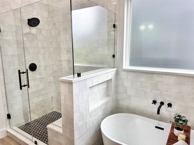 308 E 36th St, Houston, TX 77018 - bathroom featuring a shower stall and a freestanding tub
