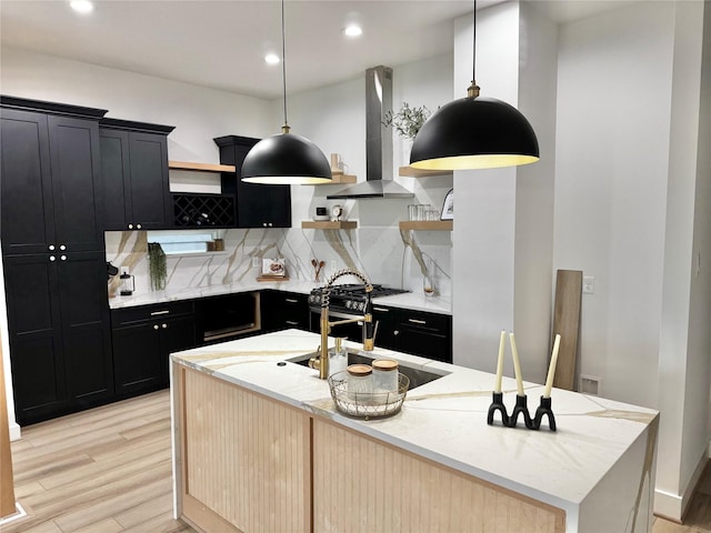 308 E 36th St, Houston, TX 77018 - kitchen featuring open shelves, dark cabinetry, wall chimney range hood, backsplash, and recessed lighting