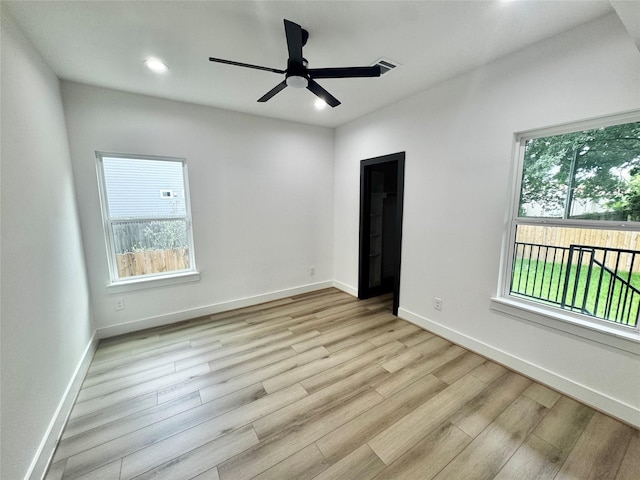 308 E 36th St, Houston, TX 77018 - spare room featuring light wood-type flooring, healthy amount of natural light, a ceiling fan, and recessed lighting