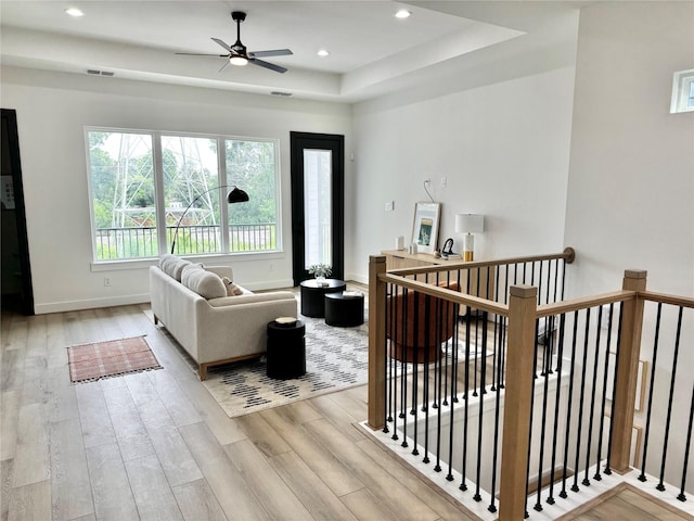 308 E 36th St, Houston, TX 77018 - living room featuring a raised ceiling, wood finished floors, a ceiling fan, and recessed lighting