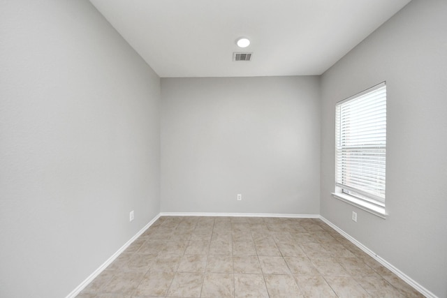 10342 Whisper Bluff Dr, Humble, TX 77396 - unfurnished room with baseboards and light tile patterned floors