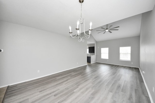10342 Whisper Bluff Dr, Humble, TX 77396 - unfurnished living room with a chandelier, wood finished floors, a ceiling fan, and high vaulted ceiling