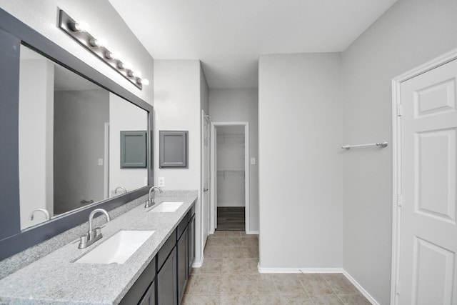 10342 Whisper Bluff Dr, Humble, TX 77396 - full bath with double vanity, tile patterned floors, and a spacious closet