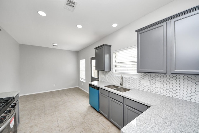 10342 Whisper Bluff Dr, Humble, TX 77396 - kitchen featuring dishwashing machine, tasteful backsplash, gray cabinetry, gas range, and recessed lighting