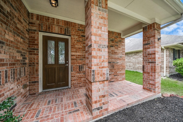 10342 Whisper Bluff Dr, Humble, TX 77396 - entrance to property with brick siding, a porch, and french doors