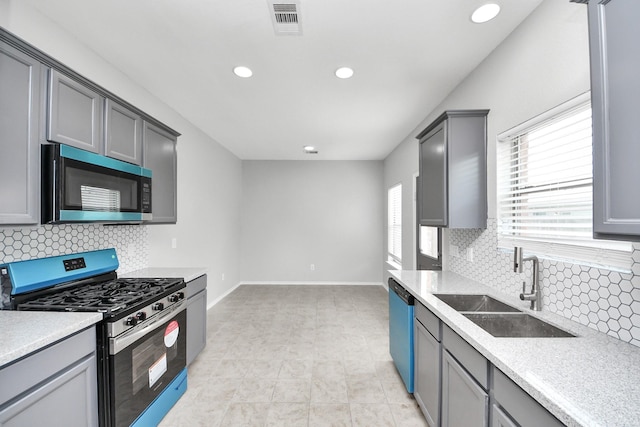 10342 Whisper Bluff Dr, Humble, TX 77396 - kitchen with appliances with stainless steel finishes, light countertops, tasteful backsplash, and recessed lighting