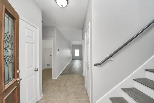 10342 Whisper Bluff Dr, Humble, TX 77396 - entrance foyer featuring light tile patterned floors and stairs