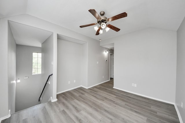 10342 Whisper Bluff Dr, Humble, TX 77396 - spare room with vaulted ceiling, wood finished floors, and ceiling fan