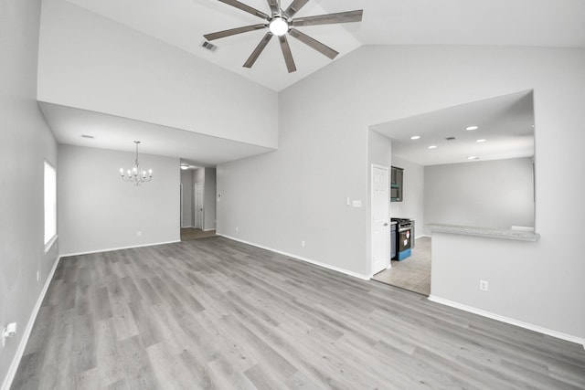 10342 Whisper Bluff Dr, Humble, TX 77396 - unfurnished living room with ceiling fan, a chandelier, light wood-style floors, and high vaulted ceiling