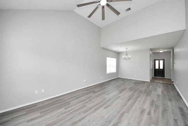 10342 Whisper Bluff Dr, Humble, TX 77396 - spare room with a chandelier, ceiling fan, wood finished floors, and high vaulted ceiling