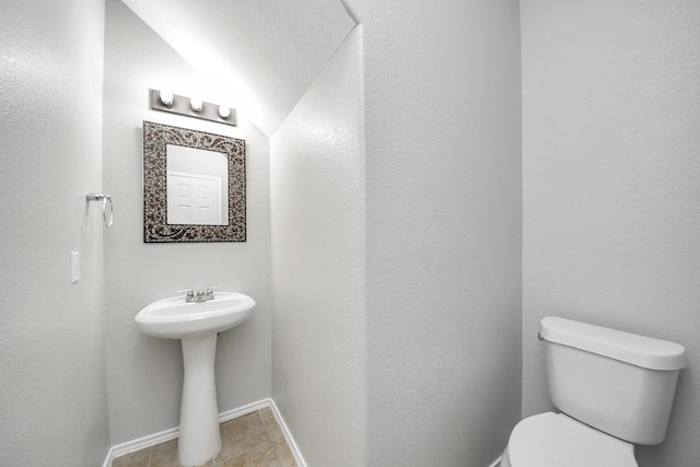 10342 Whisper Bluff Dr, Humble, TX 77396 - half bathroom with toilet and tile patterned floors