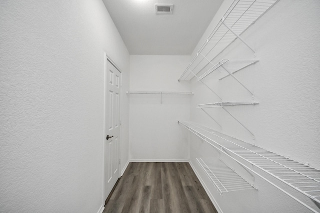 10342 Whisper Bluff Dr, Humble, TX 77396 - spacious closet featuring dark wood-style floors