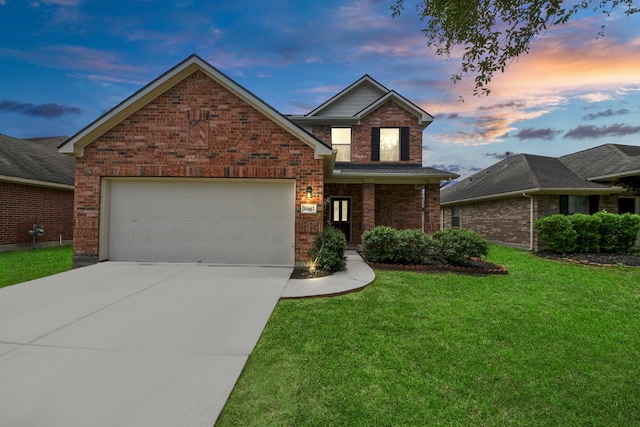 10342 Whisper Bluff Dr, Humble, TX 77396 - traditional home featuring brick siding, driveway, a front yard, and a garage