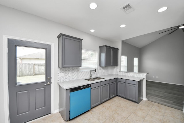 10342 Whisper Bluff Dr, Humble, TX 77396 - kitchen with dishwashing machine, a peninsula, light countertops, gray cabinets, and recessed lighting