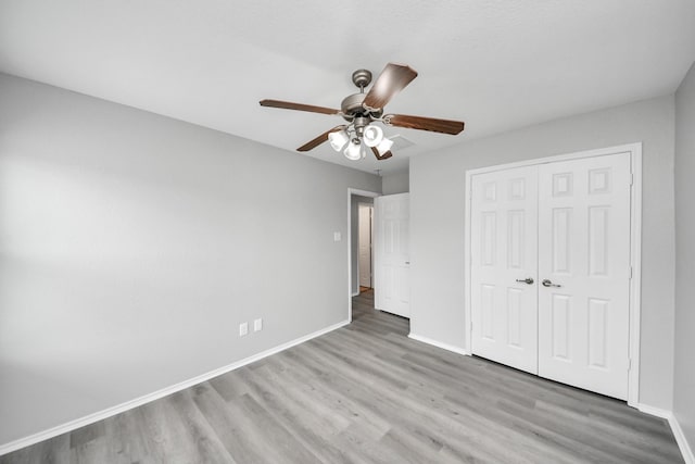 10342 Whisper Bluff Dr, Humble, TX 77396 - unfurnished bedroom with wood finished floors, a closet, and a ceiling fan