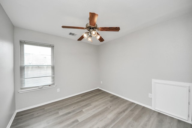 10342 Whisper Bluff Dr, Humble, TX 77396 - empty room featuring a ceiling fan and wood finished floors