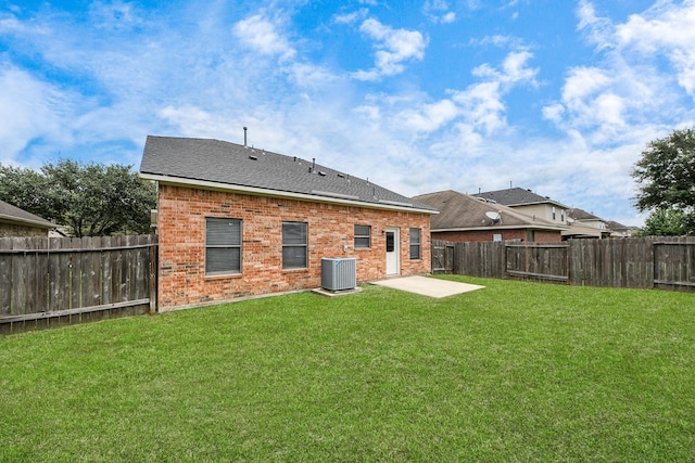 10342 Whisper Bluff Dr, Humble, TX 77396 - back of house featuring brick siding, a fenced backyard, and a patio