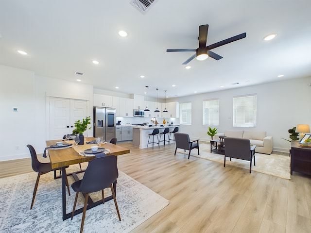 8317 Springwood Canyon Ln, Houston, TX 77055 - dining room with light wood-style flooring, a ceiling fan, and recessed lighting