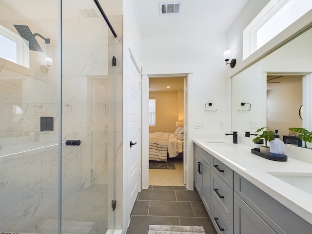 8317 Springwood Canyon Ln, Houston, TX 77055 - ensuite bathroom with a marble finish shower, double vanity, plenty of natural light, and tile patterned floors